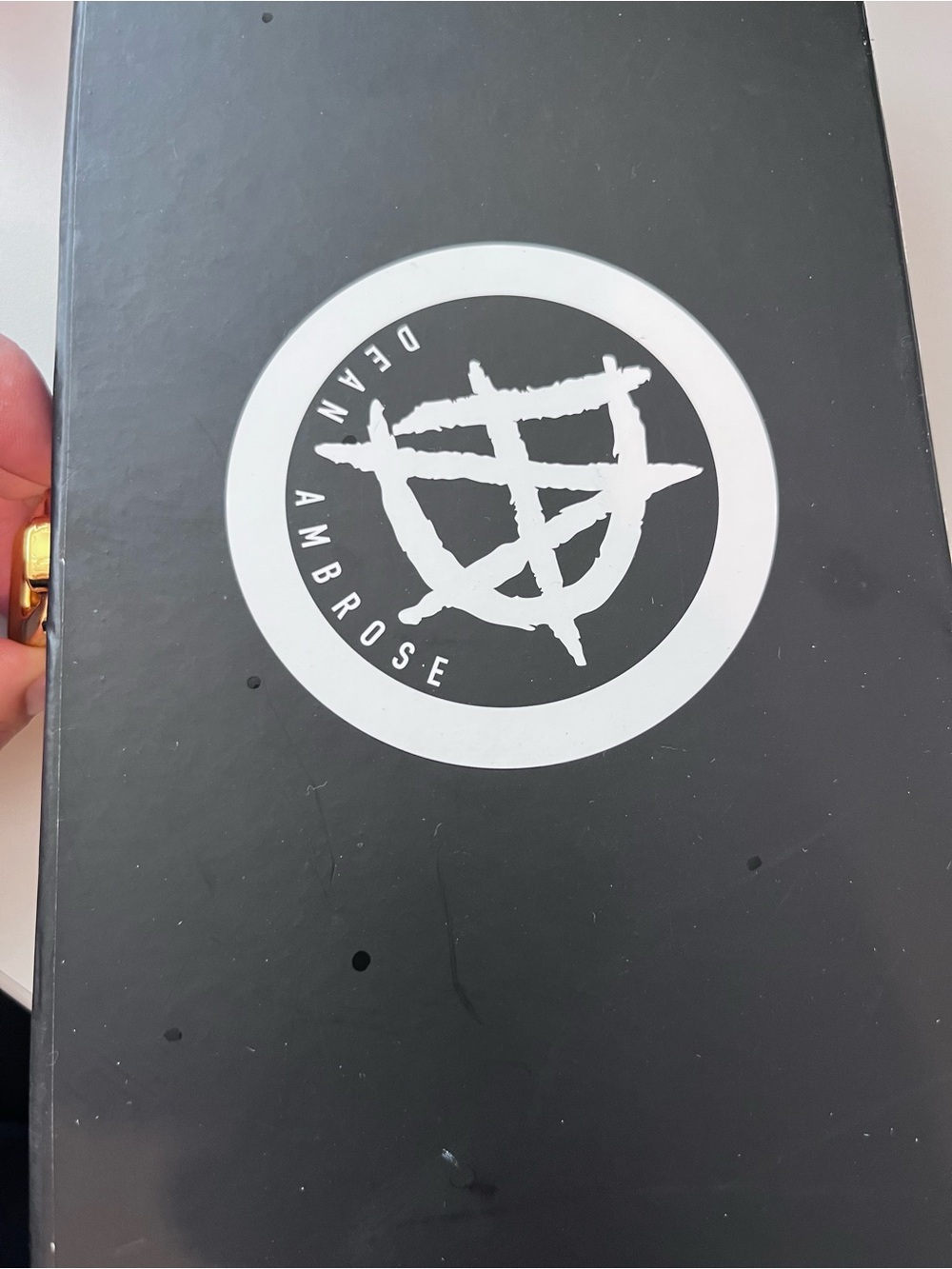 Black Wall Poster with White Circular Logo